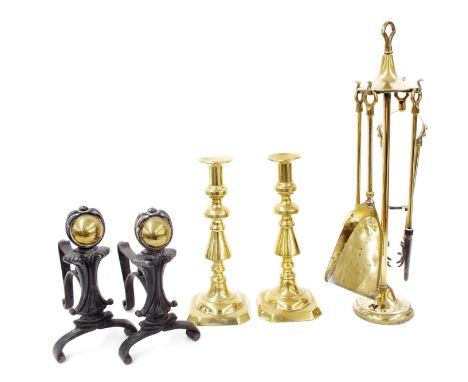 Pair of tall Victorian brass candlesticks, 12" high; together with a fireside companion stand with tools and pair of iron and
