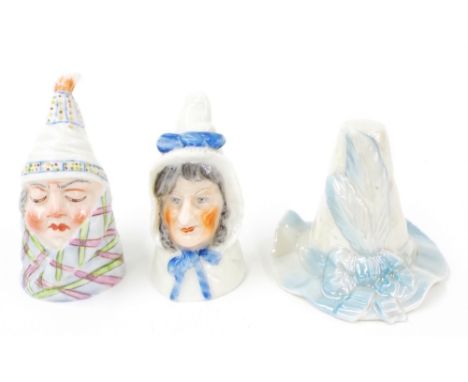 Three Royal Worcester porcelain candle snuffers; Mr and Mrs Caudle, and a feathered hat (3)