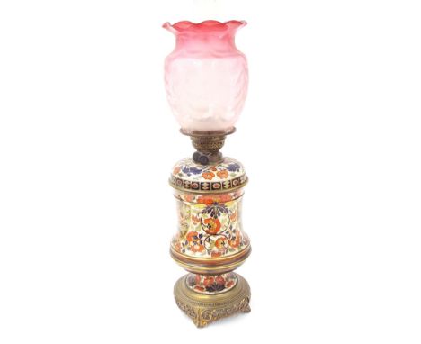 Victorian Taylor, Tunnicliffe &amp; Co and T. Hinks &amp; Son oil lamp, with a foliate pottery body and gilt metal mounts and