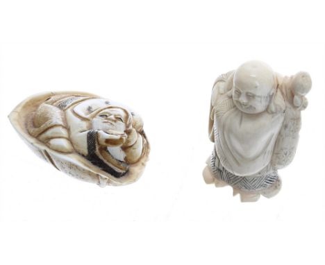 Japanese ivory netsuke of a Buddha, signed,  Meiji period, 2" high; also another netsuke modelled with a man upon a lily pad,