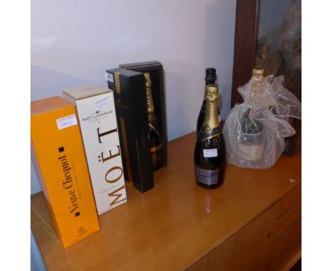 Three Moet and Chandon bottles of champagne, together with Veuve Clicquot champagne, and two bottles of sparkling wine. (6)