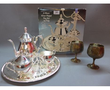 A silver plate  tea set and tray together with two silver plate goblets