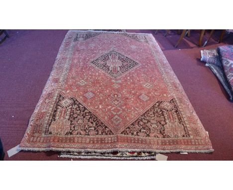 An extremely fine South West Persian Qasaqai carpet, central diamond medallion with repeating petal motifs on a terracotta fi