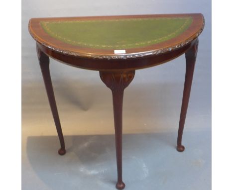 A 20th Century mahogany demi lume console table. 