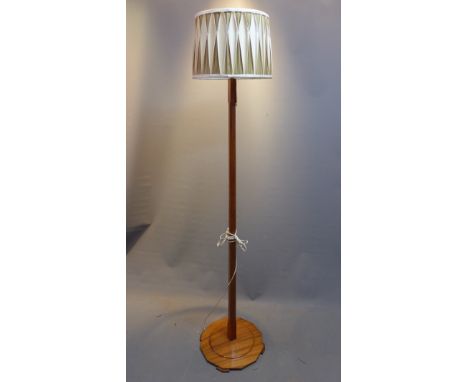 An early 20th Century oak standard lamp.