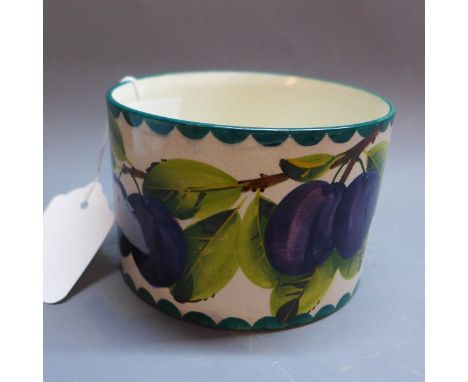 A Wemyss ceramic pot decorated with plums. 