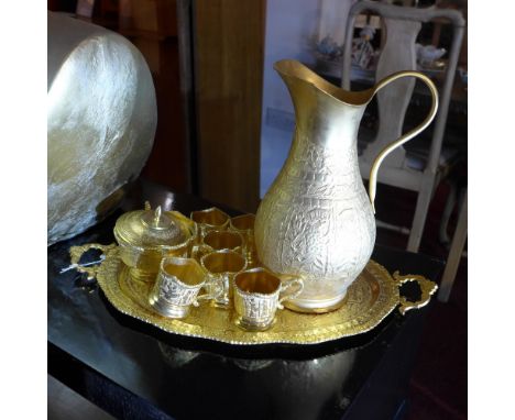 A gold coloured Middle Eastern Takhte-Jamshid tea set 