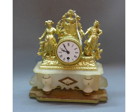 An early 20th Century French gilt metal mantle clock having alabaster base and raised on gilt wood plinth. 