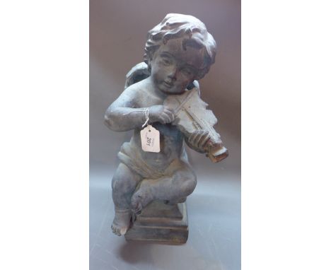A 20th Century sculpture of an angel playing a violin 