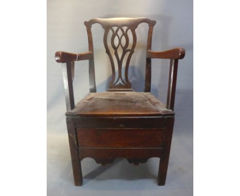 A 19th Century Chippendale style mahogany commode chair.