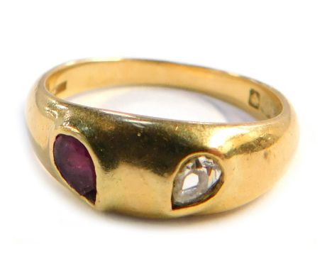 An Edwardian 18ct gold gypsy ring, set with pear cut ruby and diamond stones, Birmingham 1909, size P 1/2, 5.9g all in.