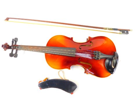 A Tatra by Rosetti Stradivarius Model violin, bears paper label, 53cm long, with bow, cased. 