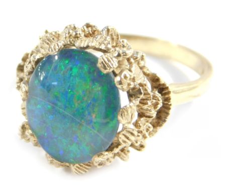 A 9ct gold opal dress ring, with oval doublet mounted in a cast mount, size P, 4.2g all in.&nbsp;