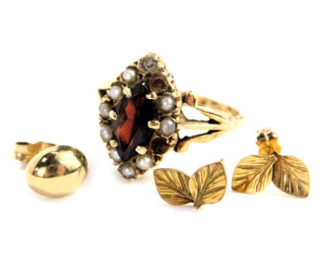 A 9ct gold lozenge shaped garnet and seed pearl ring, two seed pearls missing, a pair of ear studs, and a yellow metal ear st