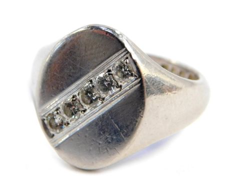 A platinum gentleman's signet ring, with oval plate set with five small diamonds, size O, 14g all in.&nbsp;