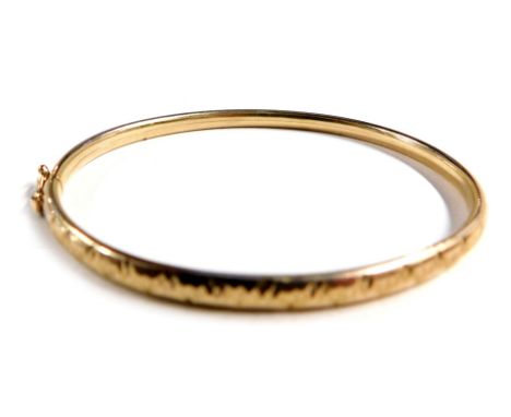 A 9ct gold child's hinged bangle, 5.2g. 