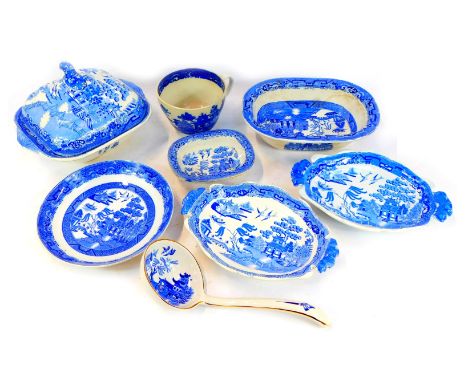 A Staffordshire blue and white Willow pattern square tureen and cover, and other Willow pattern pottery, include a soup ladle