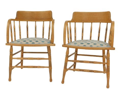 A pair of late Victorian light oak captain's chairs, 55cm wide.