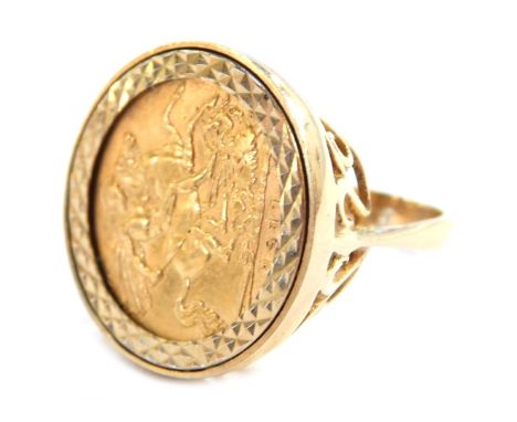 A George V gold half sovereign 1911, in a 9ct gold ring mount, size O, 8.5g all in.&nbsp;