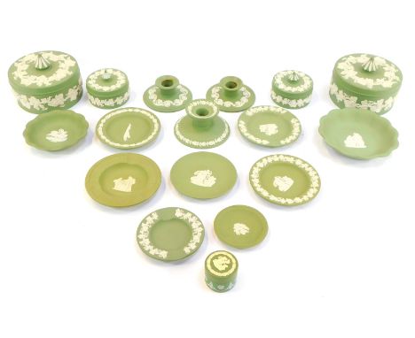 A group of green Wedgwood jasperware, to include squat candlesticks, 4cm high, trinket boxes and covers, ashtrays, trinket di