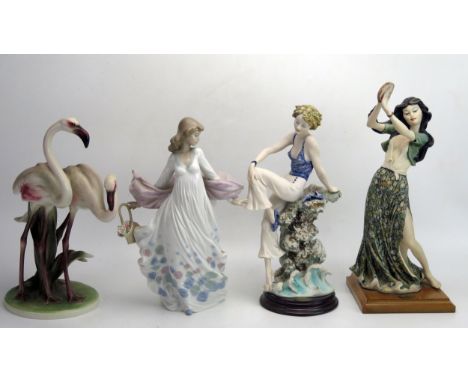 A figure of a gypsy dancer with a tambourine, on a square wooden plinth by Giuseppe Armani, Florence, 33cm high, another figu