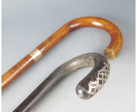 A George V 9ct gold collared walking stick, marks for J Howell &amp; Co Ltd, London, 1935, monogrammed, with horn ferrule, to