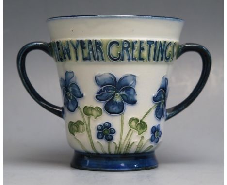 William Moorcroft for James MacIntyre and Co., a miniature twin-handled loving cup with Poppy design, 'Christmas &amp; New Ye