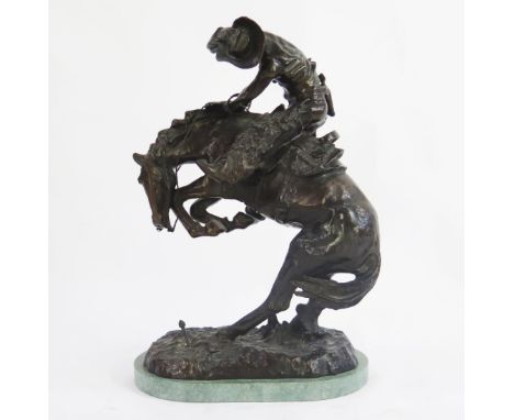 After Frederic Remington, bronze study 'The Rattlesnake', with rearing horse and rider, on a naturalistic base,  bearing sign