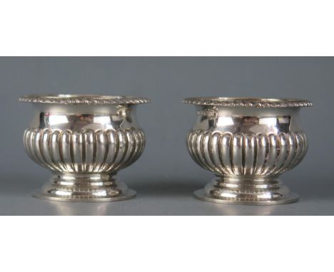A pair of late Victorian silver salts, maker Harrison Brothers &amp; Howson, Sheffield, 1900, of urn-shaped outline with half