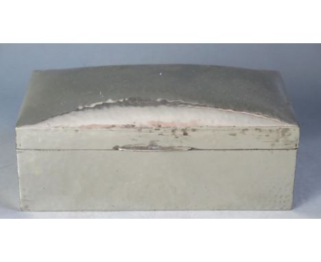 A Liberty &amp; Co 'Tudric' beaten pewter cigarette box of rectangular outline with shallow domed hinged lid, stamped 01021, 