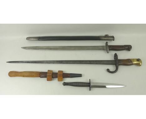 A WWI sword bayonet, Wilkinson's with scabbard, 57cm, a French bayonet from a Chassepot rifle, 65cm, and a standard issue com