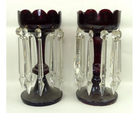 A pair of Victorian ruby glass lustres with clear glass prismatic drops, 33cm high. 