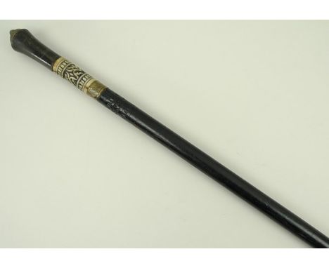 A Victorian sword stick with horn handle and carved bone section, with brass ferrule and lion head to the top of the ebonised