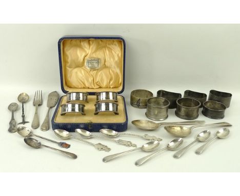 A quantity of silver, comprising a set of four silver napkin rings, Birmingham 1937, boxed, a fork London 1922, a fish knife,