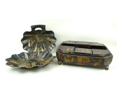 A papier mache black lacquered Japanese dish decorated with figures playing games, with a volcano in the background, 35 by 25