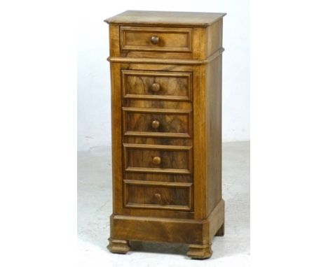 A Continental bedside cabinet, with single drawer and turned handle, above a cupboard with single shelf, the door with four f