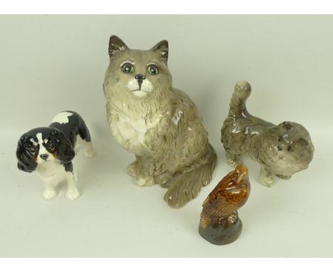 A group of Beswick figures, comprising a large grey cat in seated pose, no 1867, a grey kitten standing, King Charles Spaniel