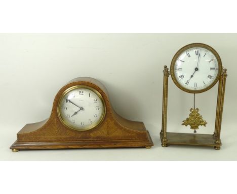 A French brass portico clock, with four pillars and fruit basket pendulum, enamel dial bearing Roman numerals, 13 by 6 by 22c