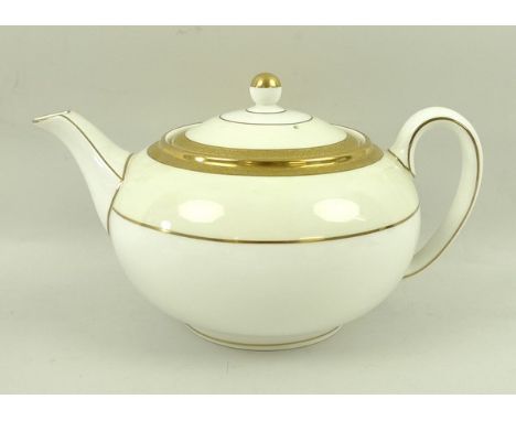 A Wedgwood porcelain tea service with gilt tooled decoration, numbered 4233 to the bases, comprising tea pot, sugar bowl, mil