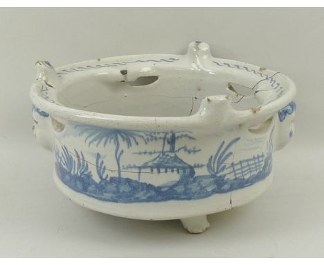 An English Delftware blue and white bowl, dated 1787, of circular, pierced form with three applied masks, painted with rural 