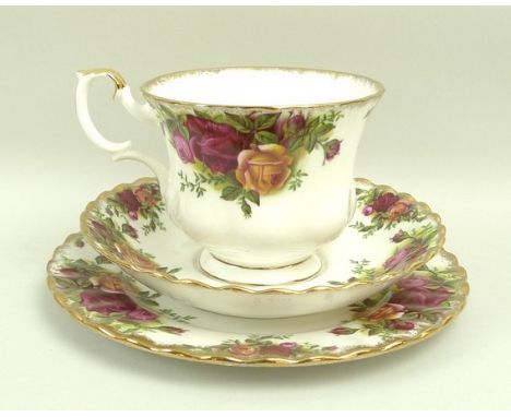 A Royal Albert porcelain part dinner and tea service decorated in the 'Old Country Roses' pattern, comprising four dinner pla