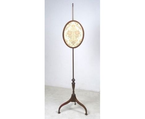 An early 20th century needlepoint fire screen on a tripod base, circa 1919, on three shaped legs and pad feet, 42 by 42 by 15