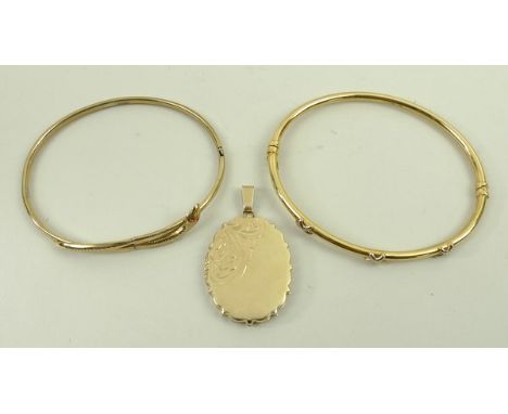 A 9ct gold serpent bangle, two colour gold bangle set with crosses at intervals, and a photo locket pendant with engraved fol
