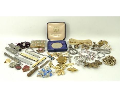 A quantity of costume jewellery together with a London territorial warden cap badge, armorial metal badge, lighter, girl and 