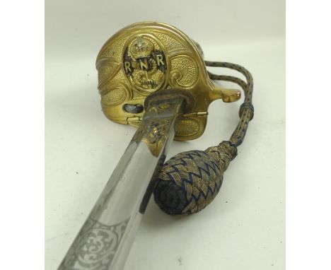 A Naval Reserve officer's sword, marked for J. Langdon and Sons, Liverpool, with a brass lion's head to the hilt, and scabbar