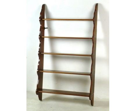 A 19th century mahogany waterfall wall shelf with tapered shaped sides, 72 by 18 by 128cm high. 