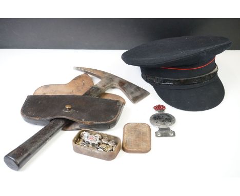 A group of Firemans equipment from an ex fireman to include cap, badges &amp; buttons and a Axe with leather sheath. 