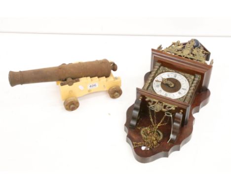 Heavy cast iron model of a canon, raised on a wooden carriage with four wooden wheels (bore diameter approx, 20mm, barrel app