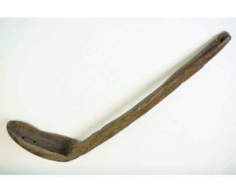 Antique carved wooden ladle / scoop, of rustic form with three pierced holes to bowl. Measures approx 55cm long 