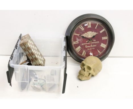 A box of mixed collectables to include a wall clock, desk clock, paper knife, pipe and a resin skull. 